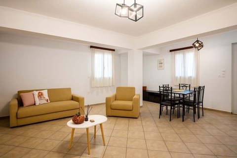 Spacious Living Room with Natural Light and Two Sofas


