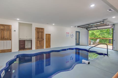 Indoor Pool with glass garage door
