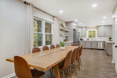 Gather around the large dining table perfect for family meals and group gatherings.
