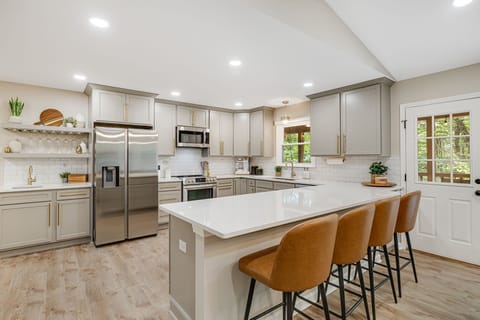 Experience our newly renovated kitchen. With modern appliances, ample counter space, and stylish decor, this space invites you to create and enjoy delicious meals during your stay.