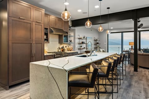 Views from either side of this bar top kitchen island will take your breath away