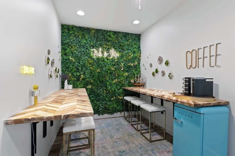 Coffee bar corner w/ café-style seating & greenery for a fun morning ritual