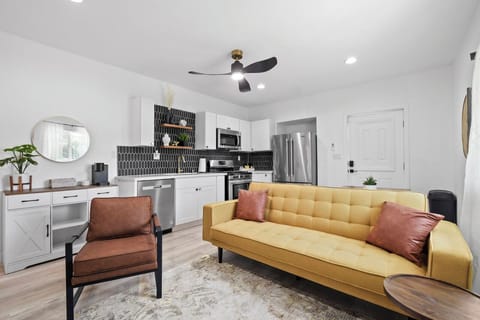 Comfortable living room with plenty of seating and a smart TV.