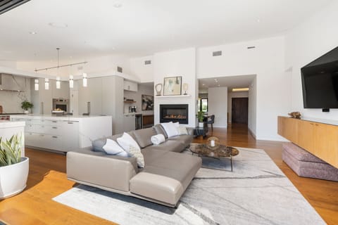 Bright living area connects to outdoor spaces for seamless indoor-outdoor flow.