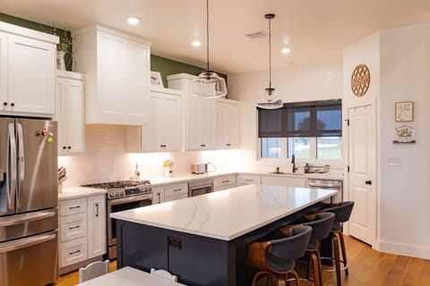 3 more stools available at the kitchen island.