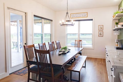 Large table sits 10 people.  Kitchen island sits 3 more.