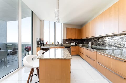 Open kitchen with balcony access.