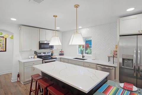 The dining table can be turned into a counter space for easy meal prep