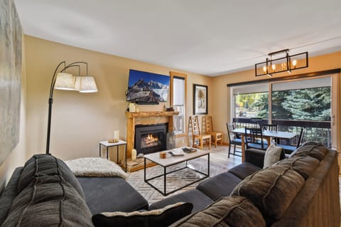 Cozy living room with gas fireplace + 55" screen w/surround sound soundbar.