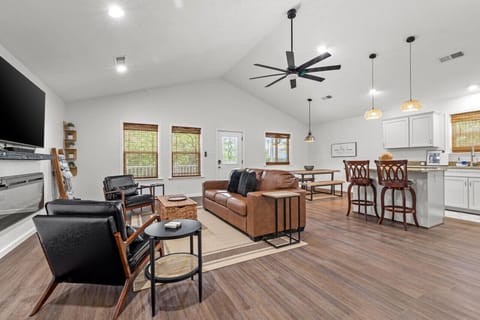 Spacious open-concept living area with pull-out sofa bed for extra guests.