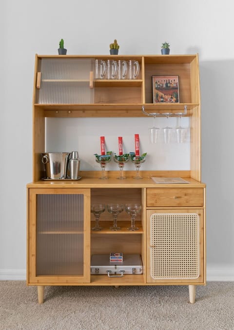 Retro bar stocked with glassware for everyone's favorite drink.