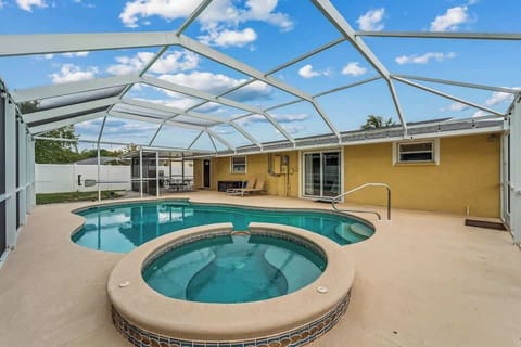 Pool size 12,000 gallons. Please note that the hot tub is not functional; it's a pool spillover feature. 