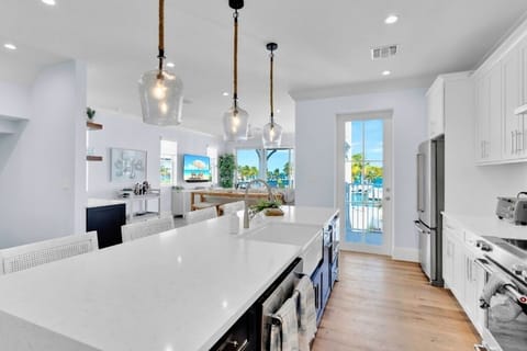 Waterfall quartz countertop and bar seating