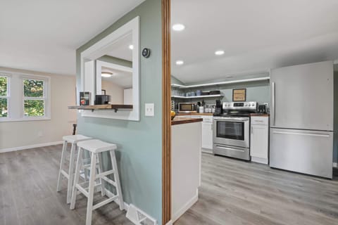 Barstool seating off the kitchen breakfast bar