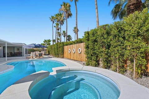 Backyard oasis with pool, hot tub, and outdoor seating