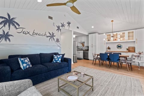 Living room view toward kitchen and dining space