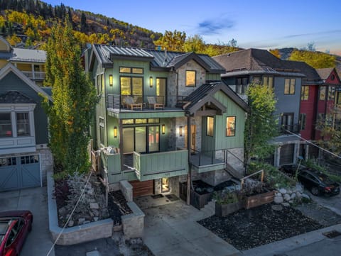 Woodside Main Street Haven's green exterior, three stories tall, five bedrooms.