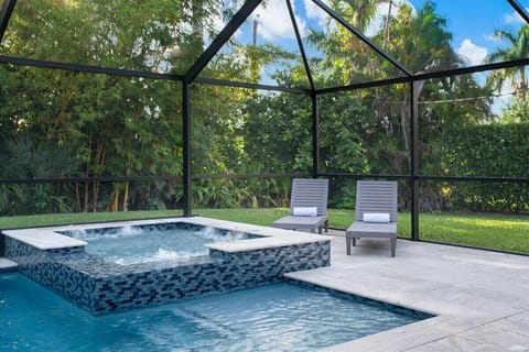 Backyard Bliss, Relax by the spa with views of the serene bamboo