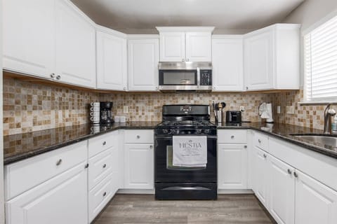 Fully equipped kitchen for one or six, complete with all essentials. Enjoy complimentary wine glasses, coffee, and tea for a convenient and relaxing stay.