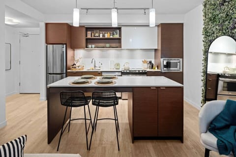 Modern kitchen with cozy breakfast bar seating for two