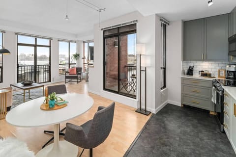 Bright dining area with city views and kitchen amenities
