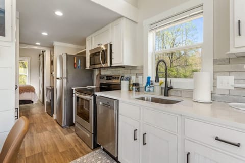Well-equipped Kitchen: Fully stocked kitchen with modern appliances and ample counter space.