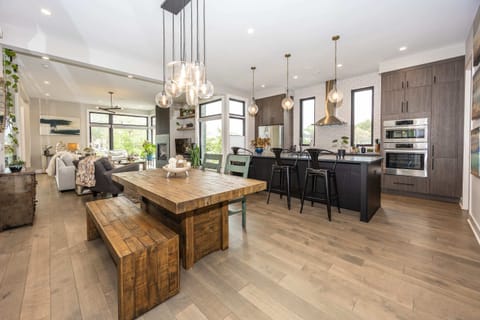 A full view of the kitchen, dining area, and living space, all seamlessly connected for effortless entertaining and relaxation.