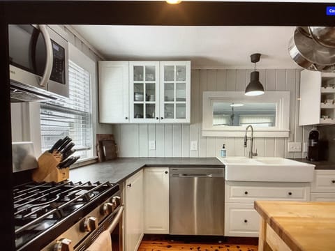 Gas stove multiple burners. Coffee pot and Keurig.  