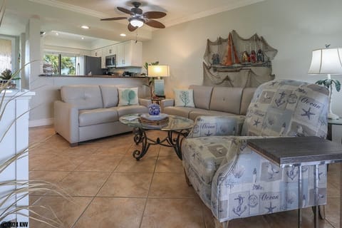 Tile and ceiling fans throughout bring easy Florida living. 
