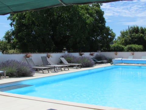 The outdoor heated pool available high season