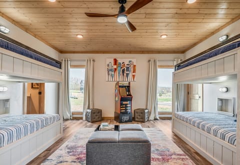 The heart of the cabin, this living area is drenched in natural light, offering a cozy space to unwind and enjoy the serene views.