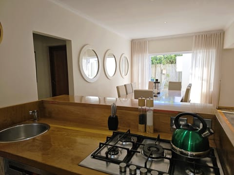 Open plan kitchen, dining flowing onto the side terrace area