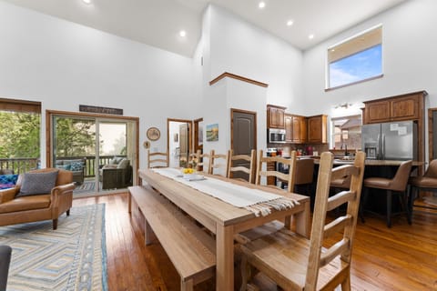 There is space for 12 people at the custom 10 ft table, plus 4 counter seats at the kitchen island. You can sit 16 people for a meal in one space.