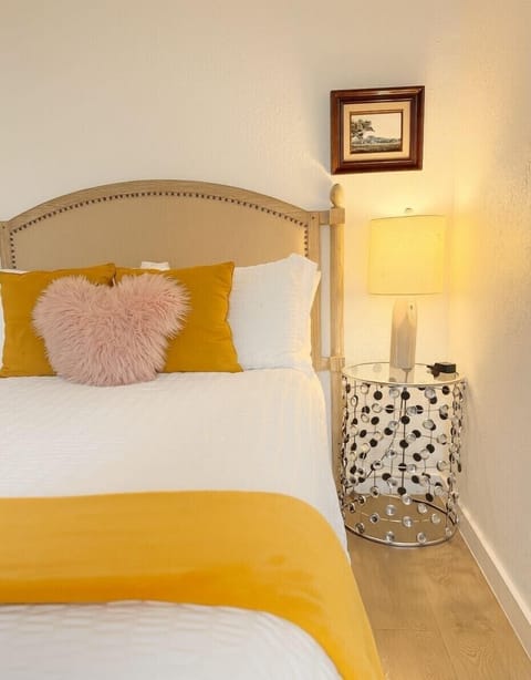 bedroom 2 has TV, queen bed and extra mattress