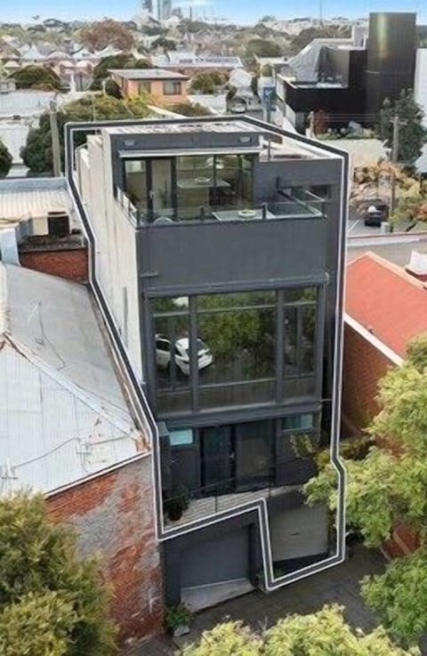 MULTI STOREY TOWNHOUSE: Lower Ground Level: Garage. Ground Floor: Two bedrooms, bathroom and sauna. First Floor: Lounge, Dining, Kitchen. Second Floor: Master Bedroom, Walk-in-Wardrobe, Ensuite, Rooftop Deck with Outdoor Table and Barbeque.  One car space in the garage on the right. 
