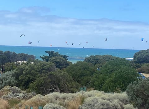 BALCONY VIEW: The view of the beach directly opposite the apartment where the kiteboarders will often be seen taking flight. This photo was actually taken from the apartment balcony. 