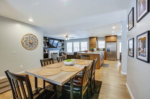 The dining area has seating for 6 and 2 additional chairs provided to accommodate 8 at the table when needed.