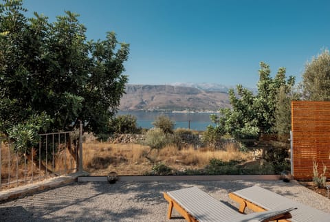 The pool terrace is equipped with sun beds and umbrellas