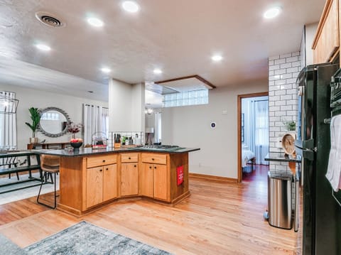 From the entryway, the kitchen is to the left (Bedroom #4 to the right) and Bedroom #1 is across from the kitchen.