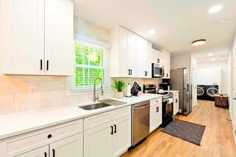 Effortlessly prepare meals in this, modern kitchen with all the essentials.