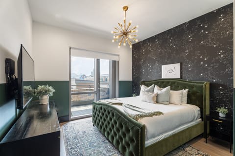 Retreat to the primary bedroom with a plush king bed, walk-in closet, blackout shades, and a smart TV. Designed for comfort and privacy, this suite is perfect for recharging after a day exploring New Orleans.