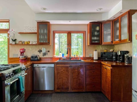 Kitchen cabinets were made by Doug Sigler of cherry wood and other materials. 