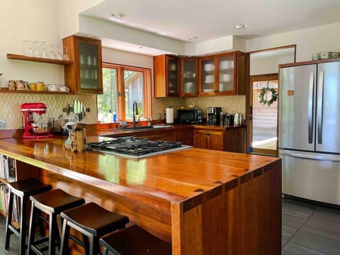 You’ll have almost anything you need to cook for a crowd including All Clad cookware, JA Henckels knives, stand mixer, dual fuel range with convection, blender, food processor, cookbooks, & lots of coffee options and an on-demand hot water dispenser!