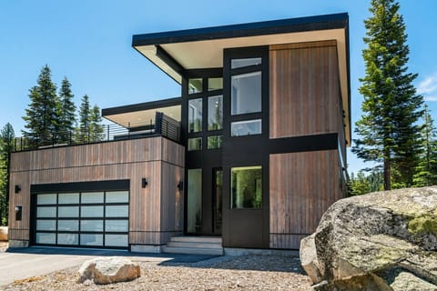 Modern mountain architecture framed by Tahoe’s forested slopes.