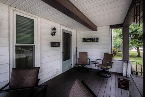 The Front Porch - Covered front porch with dining table and seating