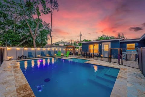 String lights and pool light create a magical atmosphere against the beautiful dawn and dusk sky.