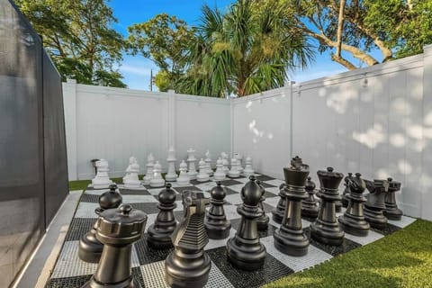 Challenge Your Mind: Enjoy a strategic game on the life-size chessboard, adding a unique touch to your outdoor fun.