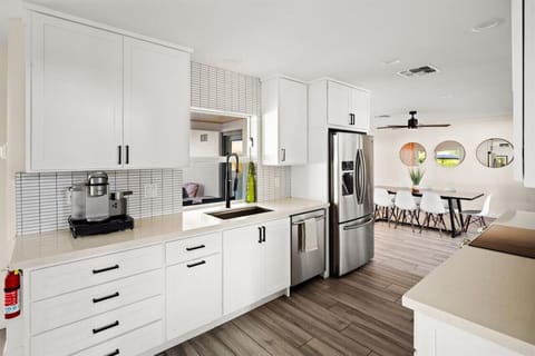 Cook with ease in this sleek, fully equipped kitchen that opens to a bright dining space.