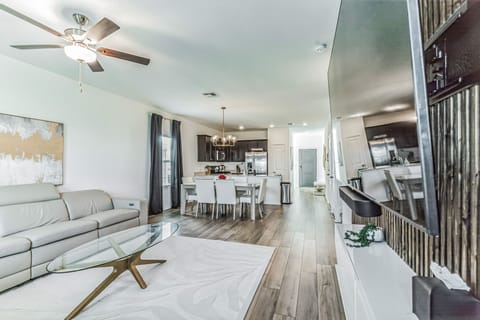 Living room with view of dining room and kitchen