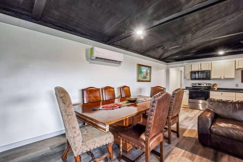 The spacious dining area is perfect for family meals or group gatherings. With ample seating and a welcoming atmosphere, it’s an ideal place to enjoy home-cooked meals prepared in the fully equipped kitchen.